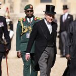 Re Carlo indossa il cilindro per accogliere il presidente nigeriano a Windsor