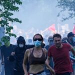 Scontri tra manifestanti anti-G7 e polizia a Ginevra prima del vertice di Evian