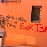 Scritte minacciose contro Giorgia Meloni a Bologna: indagini avviate per rimozione